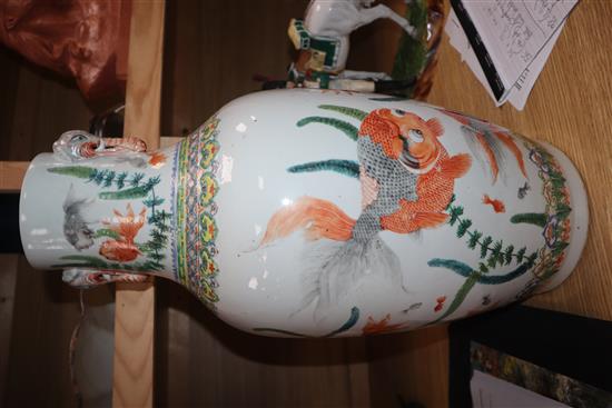 A Chinese famille verte vase, with twin elephant handles and decorated with shubunkins, restored height 22cm